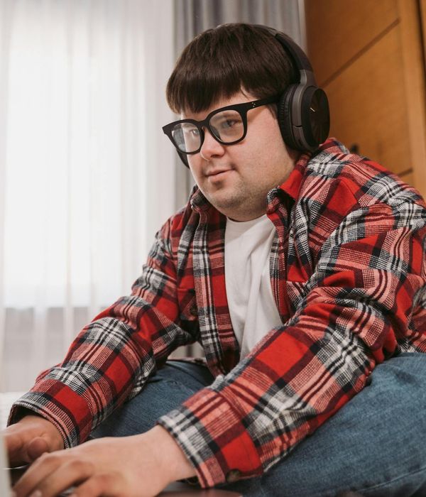 A person sitting comfortably in a well-lit modern space.
